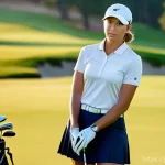 골프 프로로서의 자긍심 키우는 법 - A serene and contemplative portrait of a female professional golfer, around 30 years old, standing p...